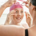 how to put on a swim cap
